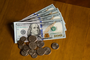 coins and banknotes of dollars.
