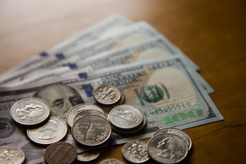 Hundred-dollar bills and coins varied.