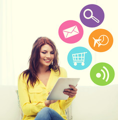 smiling woman with tablet pc computer at home