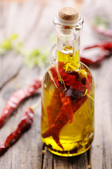 Chilli oil on wooden table