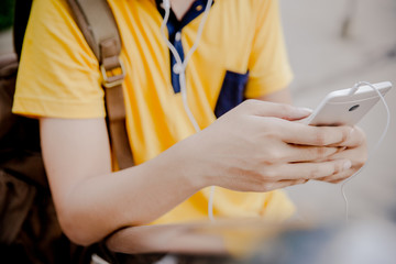 students sitting on stairs with their smartphones