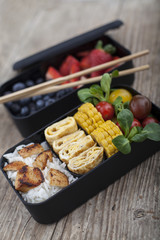 Different food in bento box - 79306935