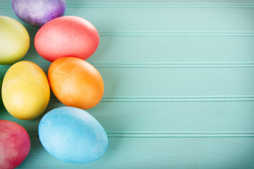 Dyed Easter eggs on a wooden panel
