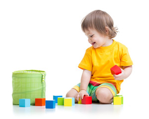 child boy playing wooden toys