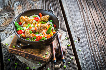 Vegetables with noodles and chicken with sesame