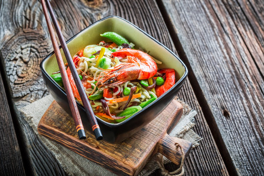 Shrimps served with vegetables and noodles