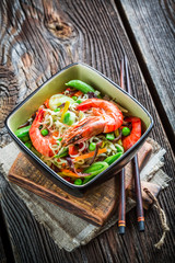 Prawns served with vegetables and noodles