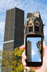 tourist taking photo of kaiser wilhelm church