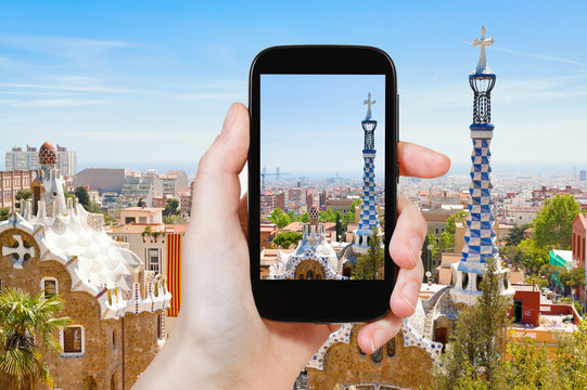 tourist taking photo of Barcelona landscape