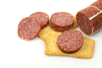 sausage slices and toast on a white background