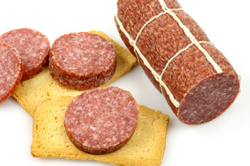 sausage slices and toast on a white background