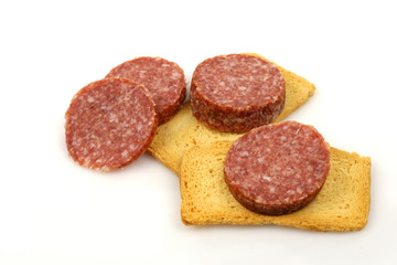 sausage slices and toast on a white background
