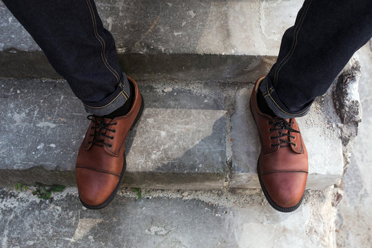 Feet of Men  in selvedge jeans and retro shoes