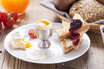 English breakfast on dark wooden table