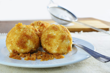 Cottage cheese dumplings on white plate