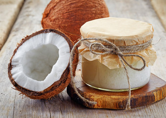 jar of coconut oil and fresh coconuts © Mara Zemgaliete