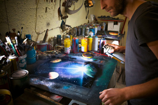 Street artist working in his studio