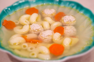 Soup with meatballs and noodles