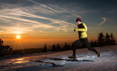 Fast running man in sunset