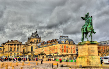 Statue of Louis XIV in front of the Palace of Versailles near Pa