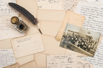 Old letters, antique feather pen and vintage photo of children