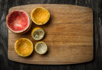 Fresh Squeezed Citrus fruit on Wood Background Rustic Style