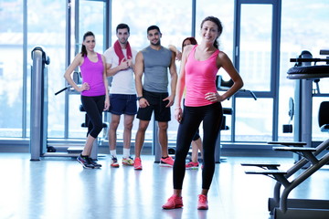 Fototapeta na wymiar Group of people exercising at the gym