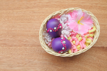 purple eggs in basket