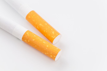 Close - up Row of Cigarette on white background .