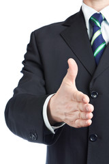 Businessman holds out his hand for handshake