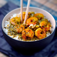 Curry prawns shrimp and rice in a bowl Caribbean food