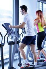 Obraz na płótnie Canvas Group of people running on treadmills