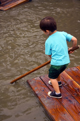 Child rafting at adventure playground
