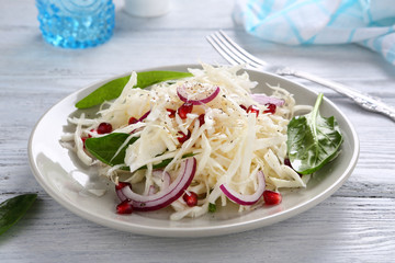 Cabbage salad and onion on a plate