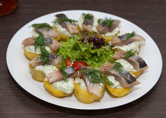 Snack with herring and potato