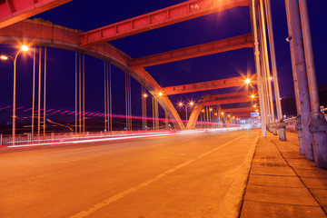 busy traffic in big city at night on  bridge