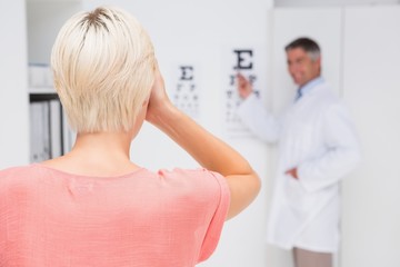 Fototapeta premium Blonde woman doing eye exam