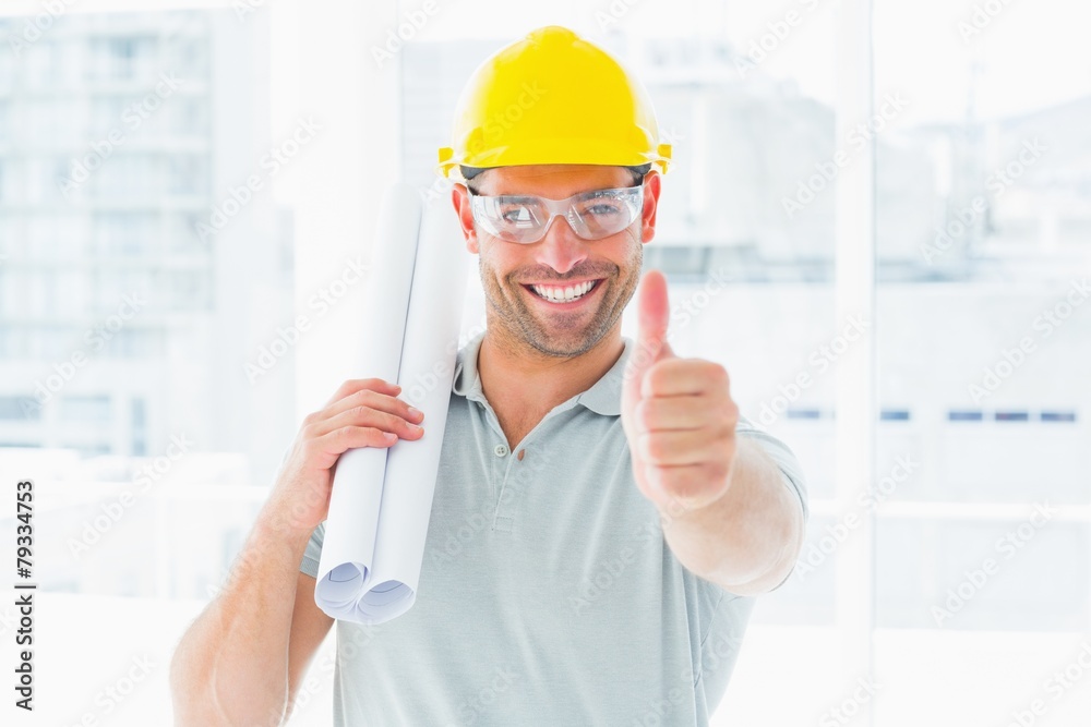Poster happy handyman with rolled up blueprint gesturing thumbs up