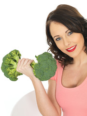 Young Woman Holding Raw Broccoli