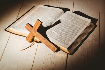 Fototapeta premium Open bible and wooden cross