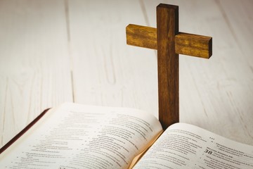 Open bible and wooden cross