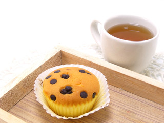 cupcake topping with chocolate ships and tea