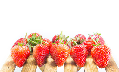 fresh strawberry on wood table isolated on white background.