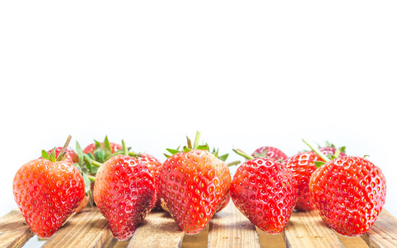 fresh strawberry on wood table isolated on white background.
