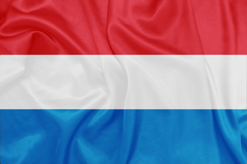 Fototapeta premium Luxembourg - Waving national flag on silk texture