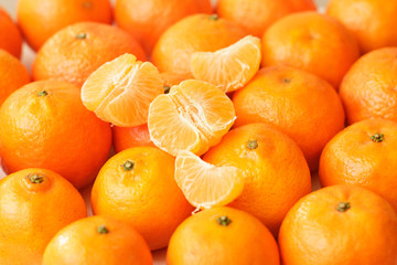 Whole tangerines and tangerine slices