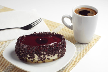 Chocolate cake with cherry jelly and coffee