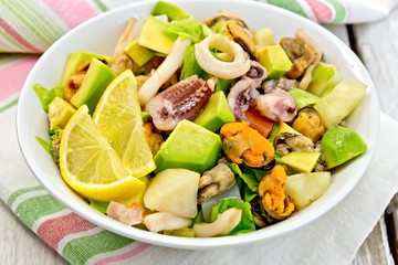 Salad seafood and avocado on linen napkin