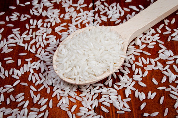 Wooden Spoon With Rice Seeds - obrazy, fototapety, plakaty