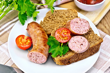 Sausages fried with bread and tomato in plate